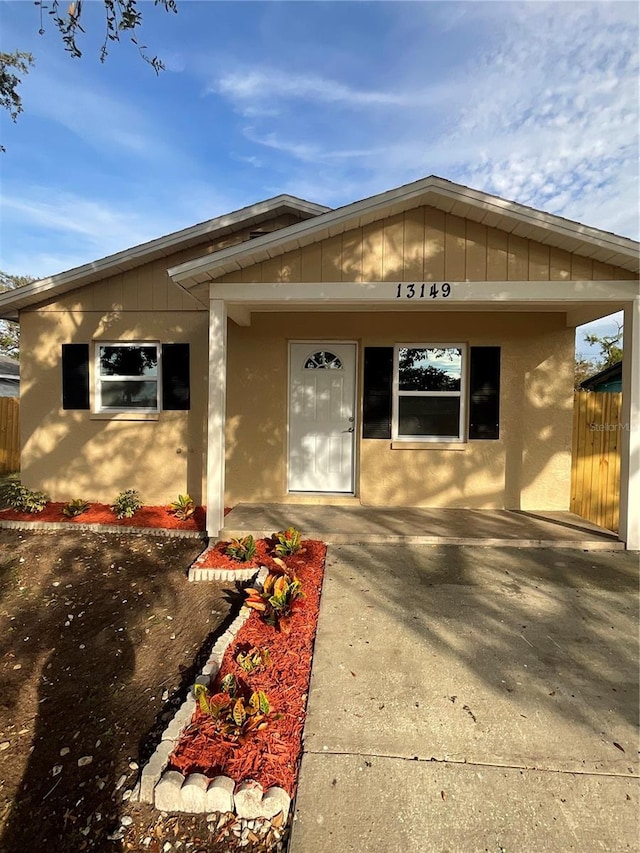 doorway to property with covered porch