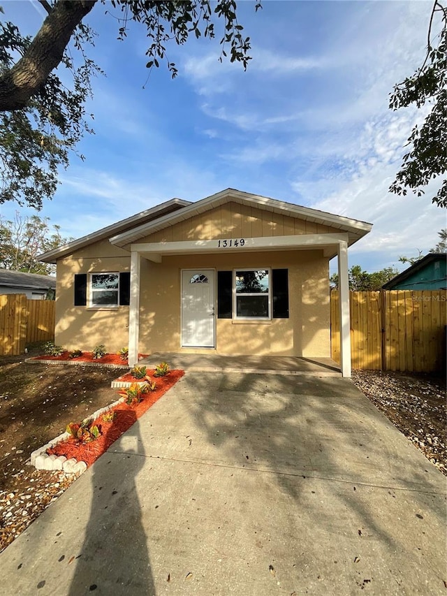 view of front of property featuring a carport