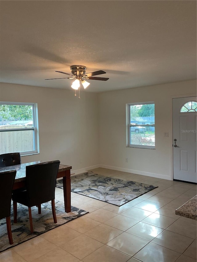 dining room featuring ceiling fan and light tile patterned floors