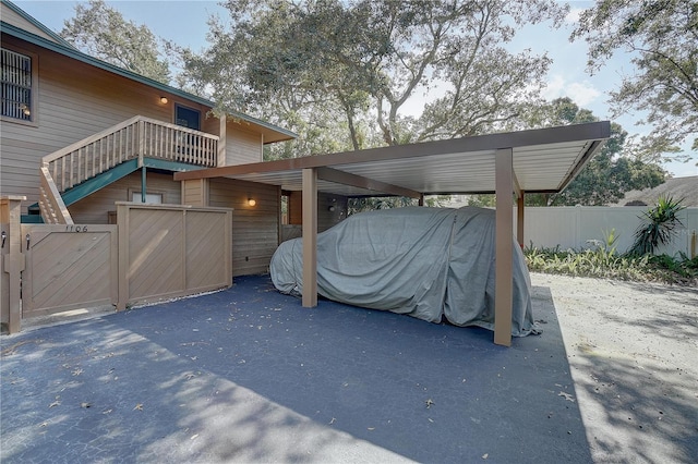 1106 Lennox Rd W, W, Palm Harbor, FL 34683 - view of patio / terrace with a carport, fence, and a gate