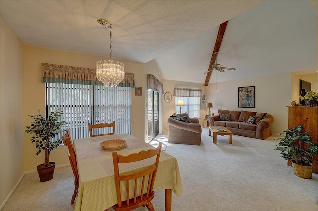 carpeted dining room featuring a textured ceiling, vaulted ceiling with beams, and ceiling fan with notable chandelier