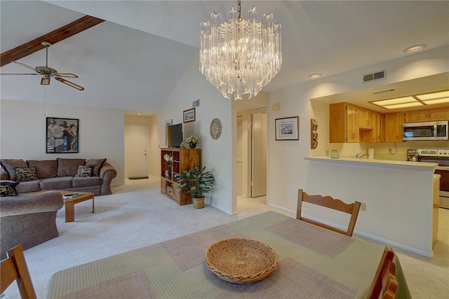 carpeted dining space featuring high vaulted ceiling, sink, and ceiling fan