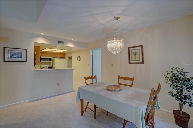 1106 Lennox Rd W, W, Palm Harbor, FL 34683 - dining space featuring light colored carpet, a chandelier, baseboards, and recessed lighting