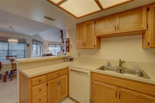 kitchen featuring kitchen peninsula, lofted ceiling, white dishwasher, ceiling fan with notable chandelier, and sink