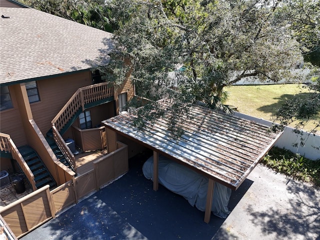 wooden terrace featuring a yard