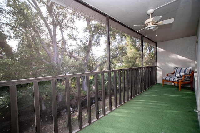 unfurnished sunroom with plenty of natural light and ceiling fan