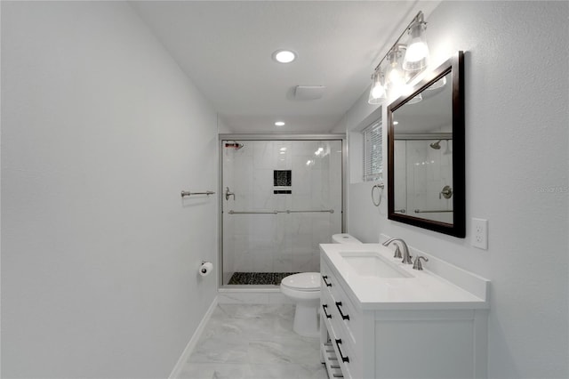 bathroom featuring vanity, toilet, and a shower with door