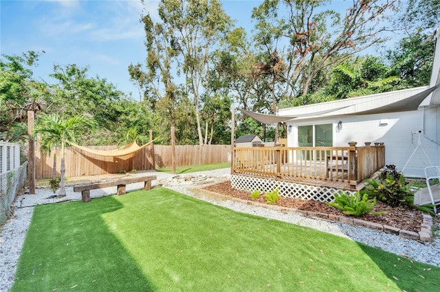 view of yard featuring a wooden deck