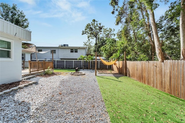 view of yard with a wooden deck