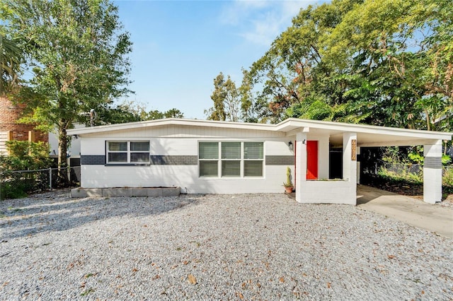 ranch-style home with a carport