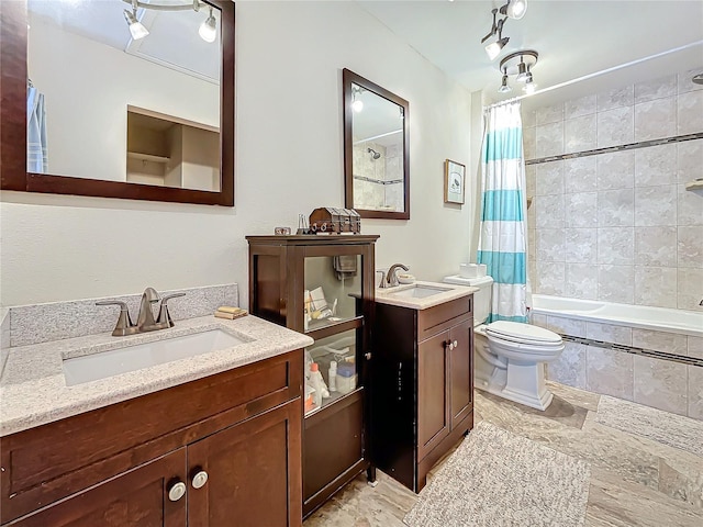 7520 Sunshine Skyway Ln S Unit 210, Saint Petersburg, FL 33711 - bathroom featuring a sink, toilet, two vanities, and tiled shower / bath combo