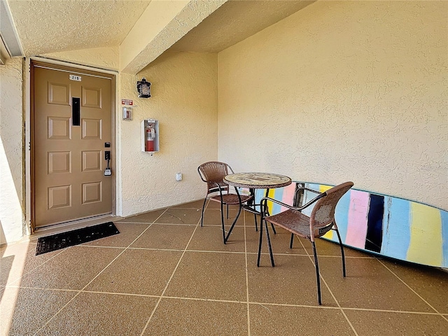 view of exterior entry with stucco siding