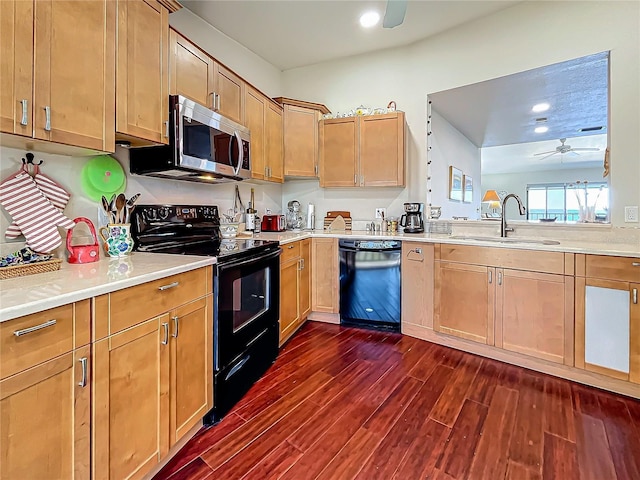 kitchen with dark wood-style floors, ceiling fan, light countertops, black appliances, and a sink