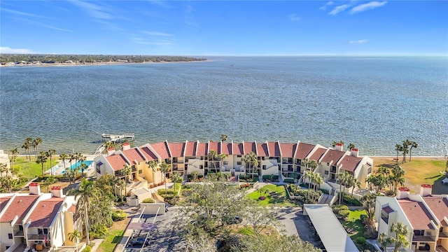 birds eye view of property with a water view and a residential view