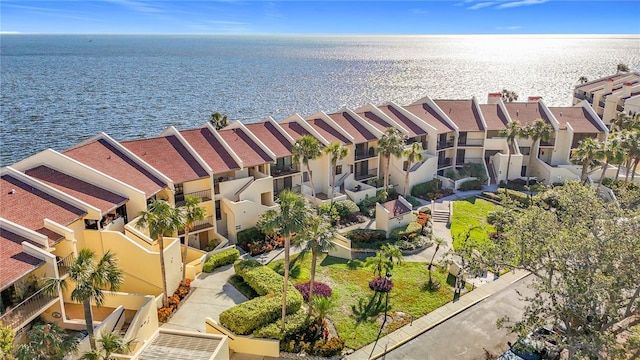 birds eye view of property featuring a water view and a residential view