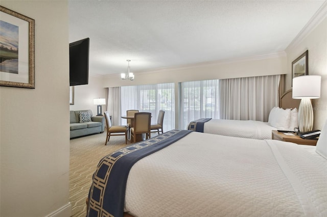 carpeted bedroom with ornamental molding and an inviting chandelier