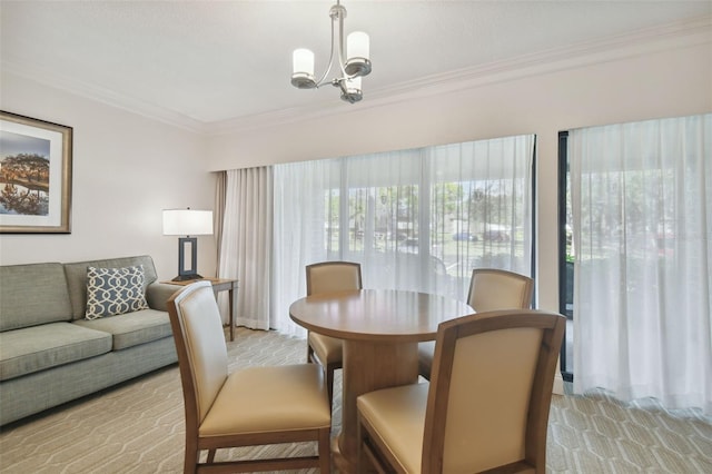 dining space featuring light carpet, ornamental molding, and an inviting chandelier