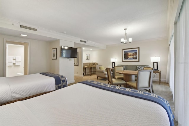 bedroom with crown molding, a notable chandelier, and light colored carpet