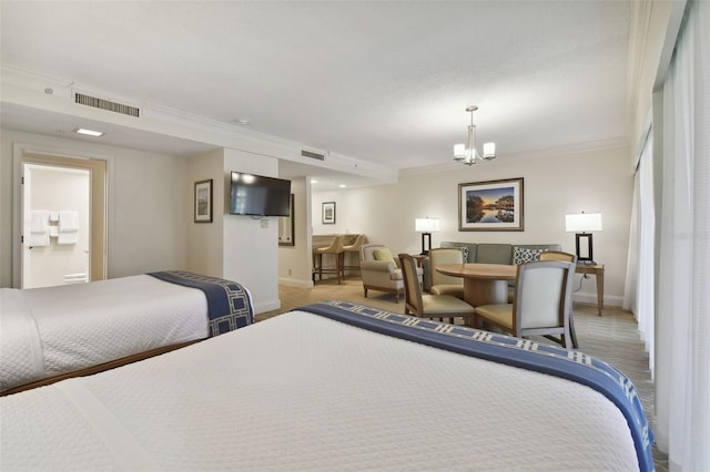 36750 US Highway 19 N Unit 09110, Palm Harbor, FL 34684 - bedroom featuring visible vents, baseboards, crown molding, and a notable chandelier