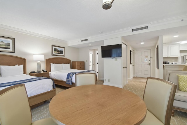 bedroom featuring crown molding