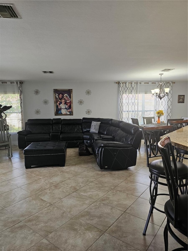 living room with a notable chandelier