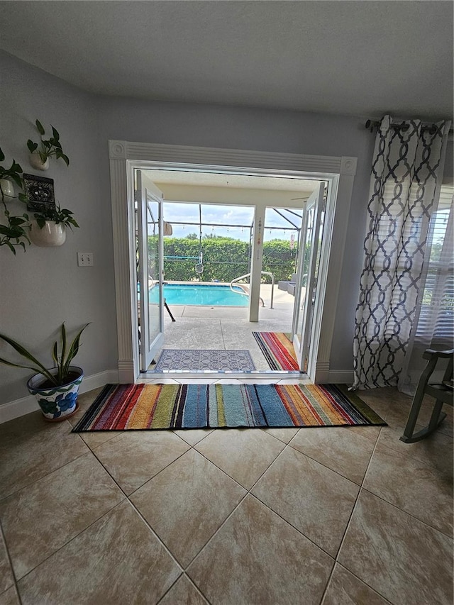 entryway with tile patterned floors