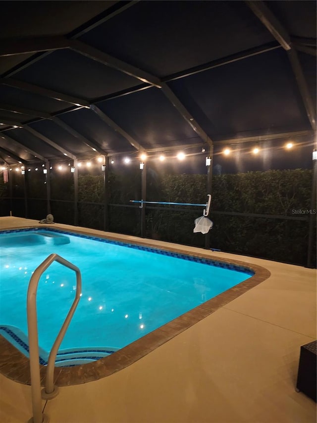 view of pool with a lanai