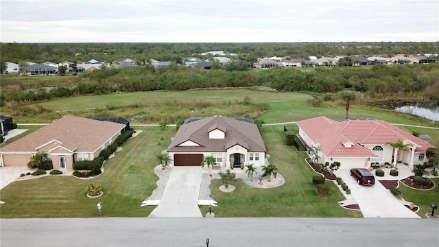 birds eye view of property with a water view