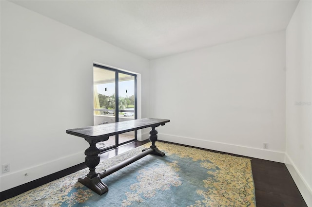 office area with baseboards and dark wood-style floors