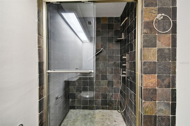 bathroom featuring a shower stall