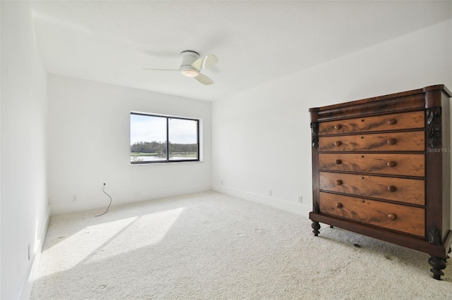 unfurnished bedroom with carpet floors and a ceiling fan