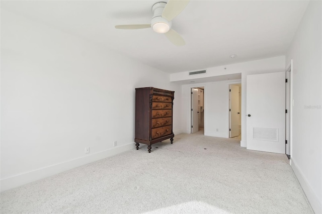 unfurnished bedroom featuring light colored carpet and ceiling fan