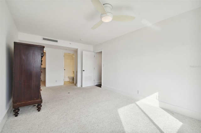 bedroom with connected bathroom, ceiling fan, a closet, and light colored carpet