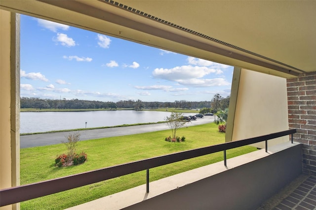 balcony featuring a water view