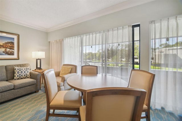 dining space featuring ornamental molding