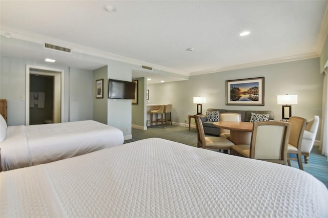 carpeted bedroom with ornamental molding