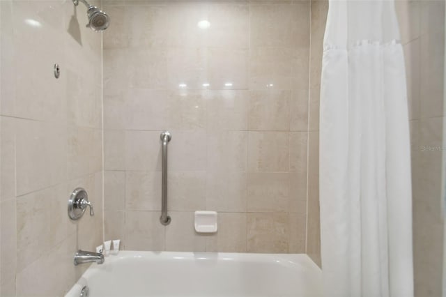 bathroom featuring shower / tub combo with curtain