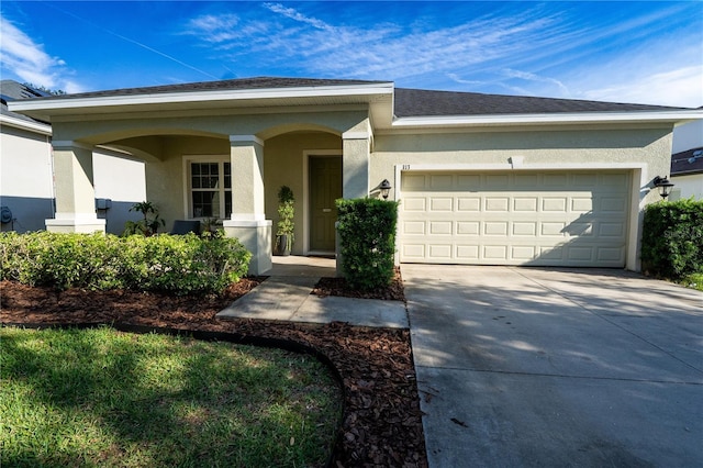 single story home featuring a garage