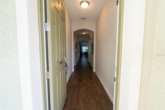 hall with dark hardwood / wood-style flooring