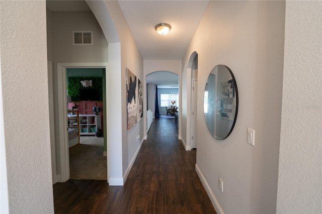 hall featuring dark wood-type flooring