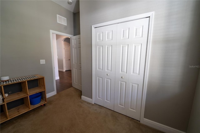 bedroom with a closet and carpet flooring