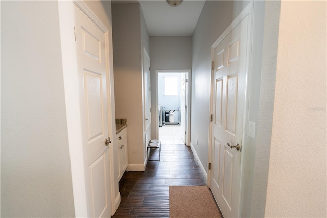 hallway featuring dark hardwood / wood-style flooring