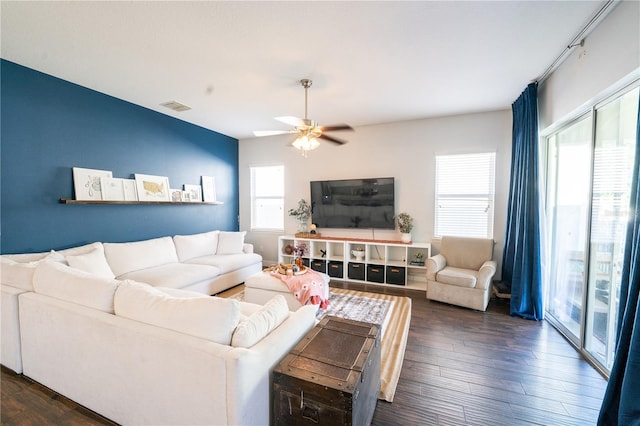 living room with dark hardwood / wood-style floors and ceiling fan