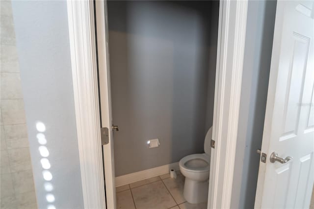 bathroom featuring tile patterned floors and toilet