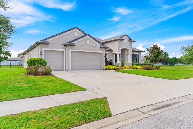 single story home featuring a front lawn and a garage