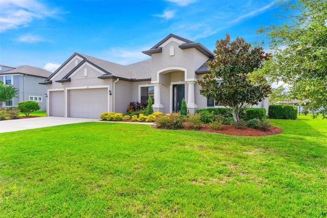 view of front of house with a front lawn and a garage