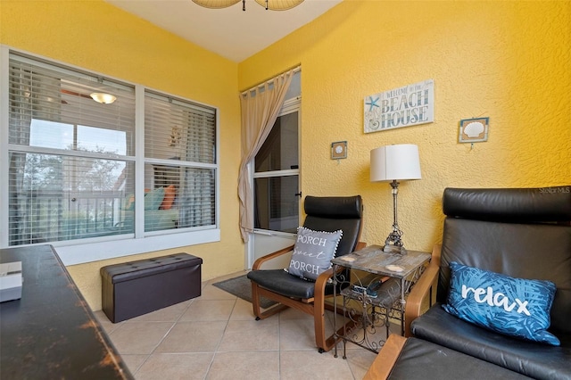 living area with tile patterned floors