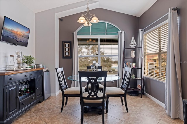 dining area with a chandelier, light tile patterned flooring, and a healthy amount of sunlight