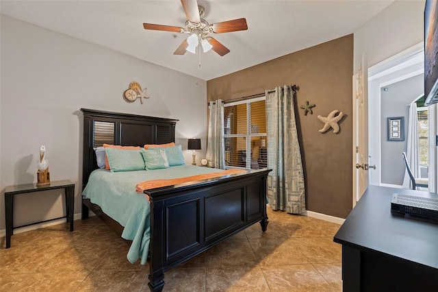 tiled bedroom with ceiling fan