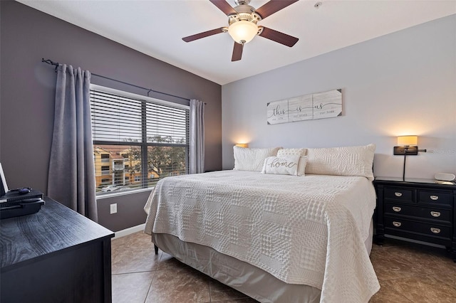 tiled bedroom with ceiling fan